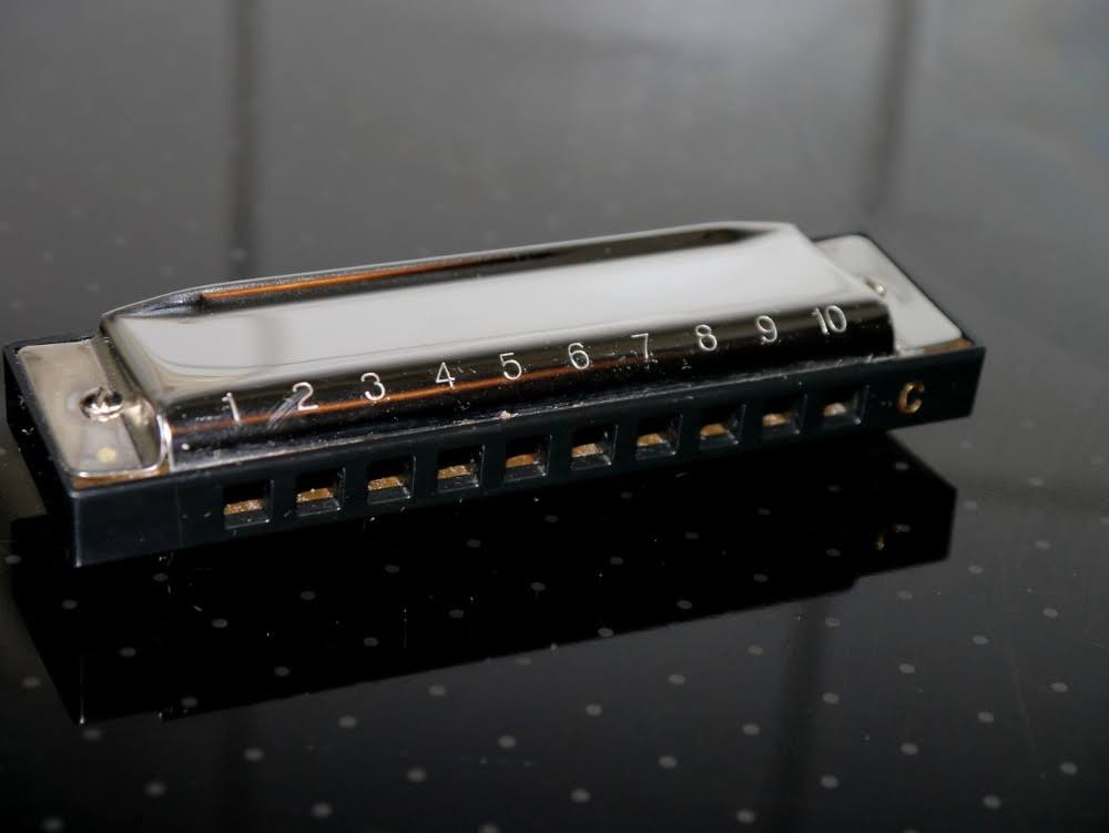 Silver harmonica.